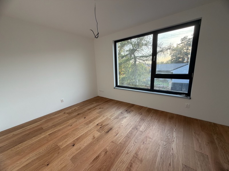Site photo: upstairs room with oak flooring and a large window